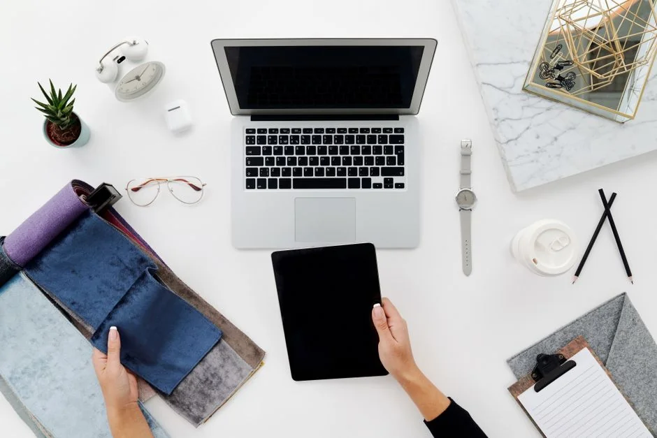 A contemporary workspace showcasing a laptop, tablet, and smartphones, ideal for tech and freelance use.